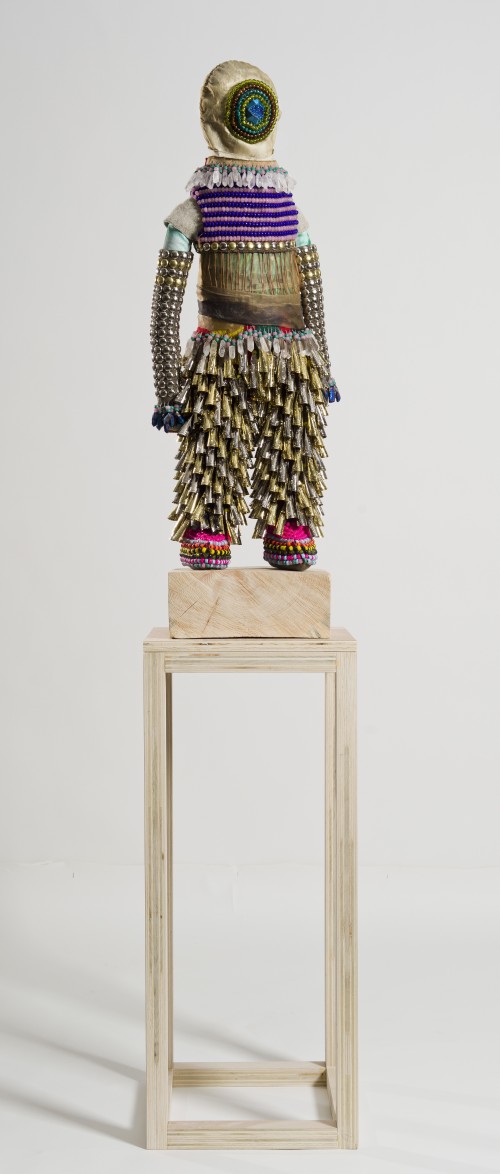 Jeffrey Gibson. Here It Comes, 2014. Deer rawhide, glass and plastic beads, wool blanket, beetle wings, artist’s own repurposed painting, artificial sinew, Drusy quartz, steel and brass studs, 37 ½  x 13 ½  x 6 ½ in. Courtesy of the artist and Samsøn, Boston, MA & MARC STRAUS, New York.